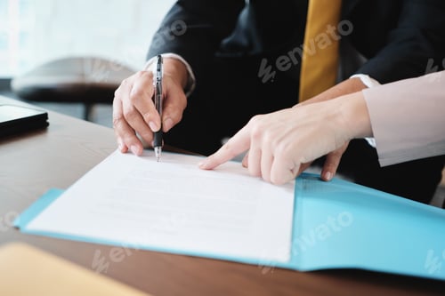 Preview: Asian Manager Signing Agreement For Health Insurance With Business Woman