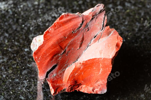 Preview: sample of raw red mookaite mineral on black