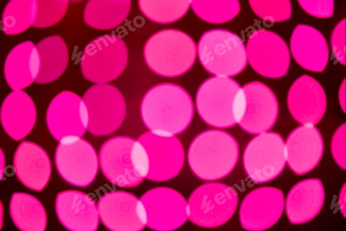 Preview: Colorful out of focus pink lights in the city night