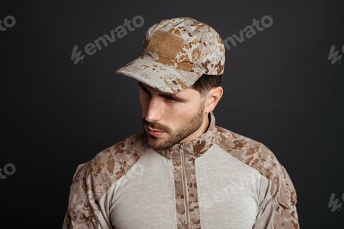 Preview: Close up of a handsome pensive young military man
