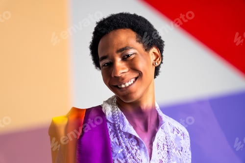Preview: Fashionable fluid gender man posing in studio
