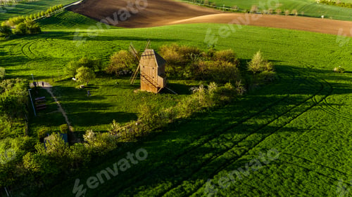 Preview: charming windmill in blooming orchards of czech village