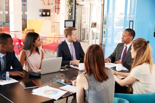 Preview: Business colleagues talking in a meeting room
