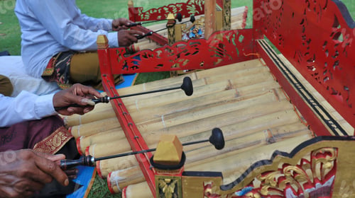 Preview: Group of musicians performing on traditional Balinese Rindik instruments in a public park