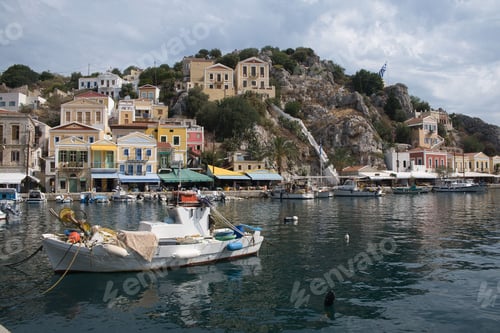 Preview: Picturesque view of a tranquil town nestled on the shore of the sea in Symi island, Greece.