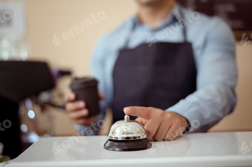 Preview: Baristas hand taking cup of hot coffee and bakery to offering to customer in coffee shop