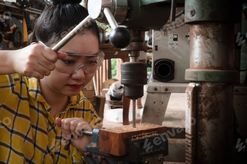 Preview: Women standing is craft working drill wood
