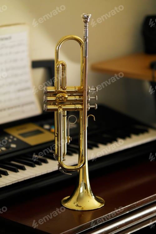 Preview: Beautiful shot of a trumpet near the piano