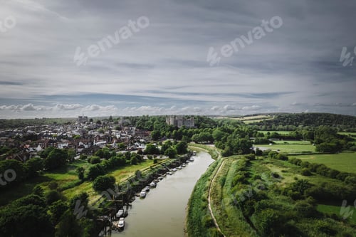 Preview: Aerial view of the River Arun surrounded by green vegetation. Arundel, West Sussex, England.