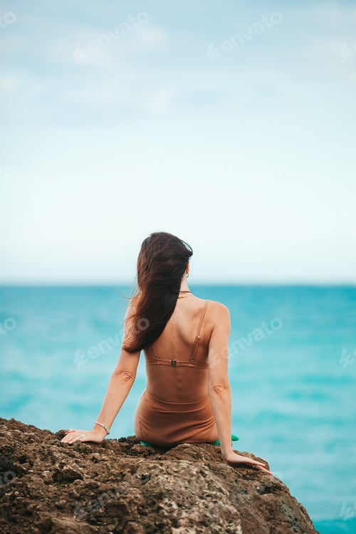 Preview: Young happy woman on the beach enjoy her summer vacation