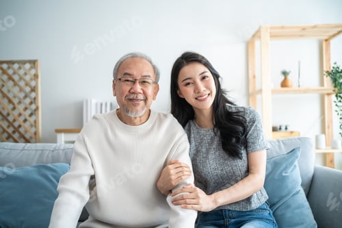 Preview: Portrait of Asian beautiful daughter hugging and sit with older father.