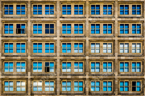Preview: Modern brown building with blue glass windows and rusty aesthetics