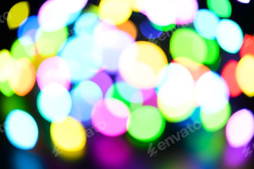Preview: blurred night multicolored glowing lights on black background. new year and christmas concept