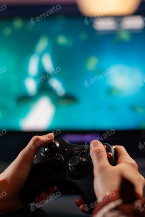 Preview: Close up of wireless joystick, gamer playing online videogames