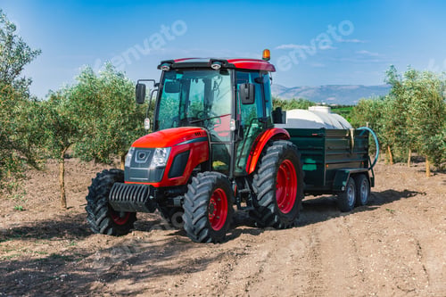 Preview: Tractor in olive grove during daytime in Andalusia, Spain