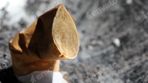 Preview: Closeup shot of a smoked cigarette