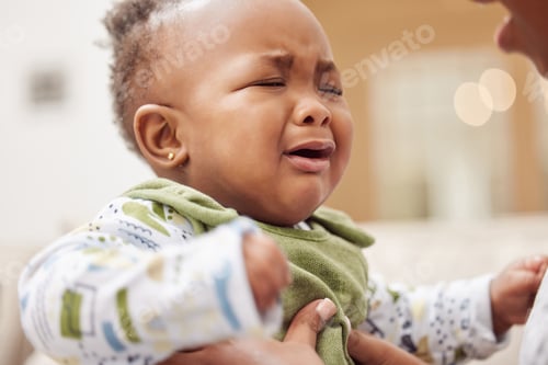 Preview: I just want a hug. Shot of a baby girl crying while sitting at home.