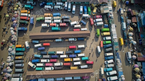 Preview: Aerial shot of a lorry station full of colorful cars, Ghana