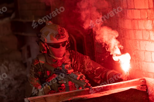 Preview: Soldier in full US MARSOC armed with assault rifle run through the abandoned building. Military
