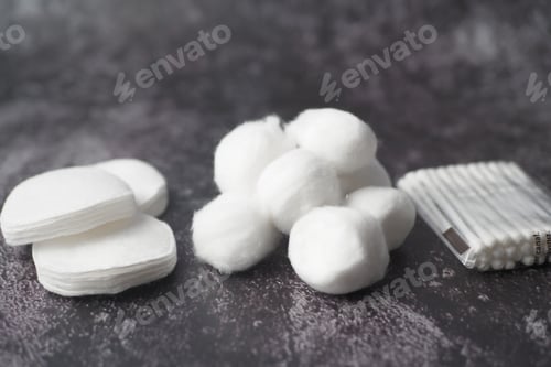 Preview: Cotton Pads, Balls, and Swabs on a Textured Surface, Essential Hygiene Items for Beauty and Wellness