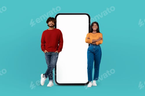 Preview: Multiethnic couple exhibit cheerful expressions next to an oversized smartphone