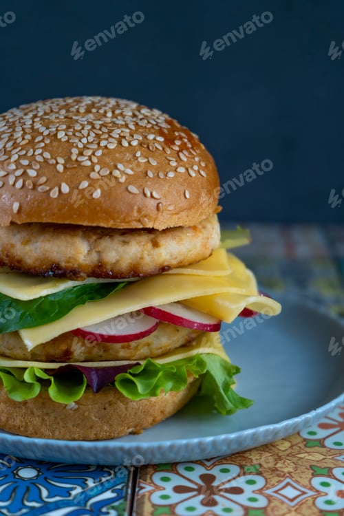 Preview: Hamburger bun, double chicken cutlet with cheese, lettuce, arugula and radish. Meat, vegetables and