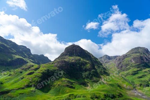 Preview: Three Sisters in Glencoe under a blue sky.