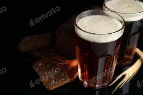 Preview: Delicious kvass, bread and spikes on black background