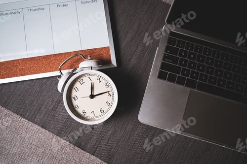 Preview: The top view of the clock and computer for time management of work and balance life.