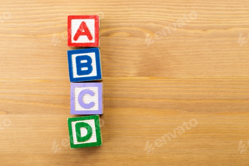 Preview: ABCD wooden toy block over the wooden background