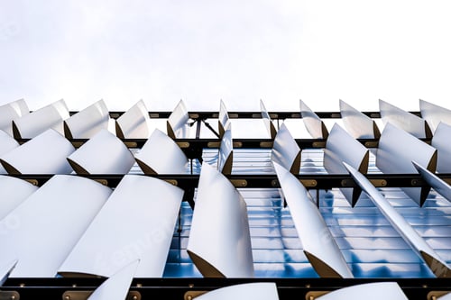 Preview: The facade of a modern building with an innovative facade made of automatic, movable blinds.