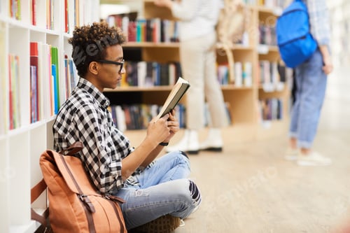 Preview: Clever boy reading interesting book