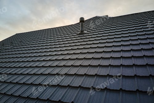Preview: Closeup of house roof top covered with metallic shingles.Tiled covering of building