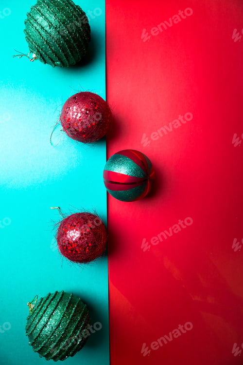 Preview: Christmas ball on green and red pepper backround.