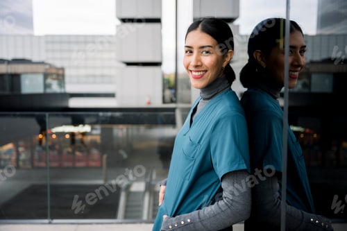 Preview: Confident female healthcare professional smiling outdoors