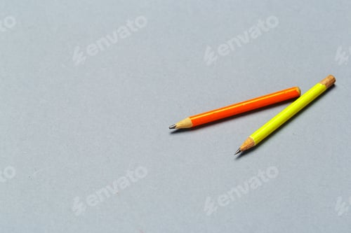 Preview: Well worn yellow pencils on light gray background
