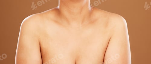 Preview: Woman, chest and skincare on a brown studio background for health, wellness and breast cancer aware