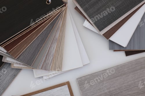 Preview: Different samples of wooden flooring on white table, top view