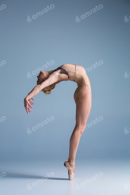 Preview: Young beautiful modern style dancer posing on a studio background
