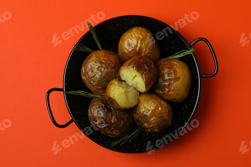 Preview: Bowl with baked potato on orange background