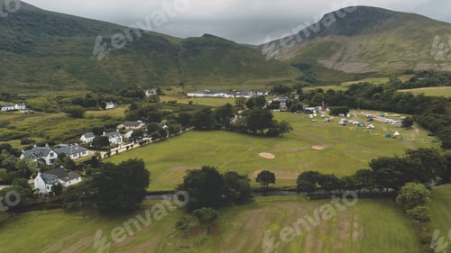 Preview: Whiskey distillery at mountain green valley. Nobody nature landscape at summer cloudy day