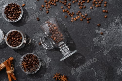 Preview: Coffee beans, cinnamon sticks and star anise on dark background top view