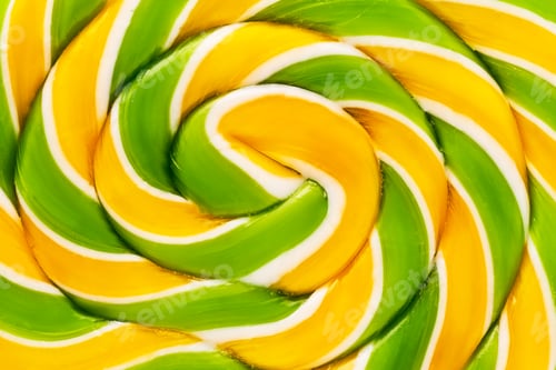 Preview: A close-up of a big yellow-green lollipop. Can be used for background, top view