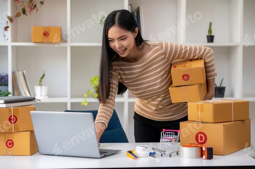 Preview: Asian business woman talking to clients on live video, selling online business. Working from home in