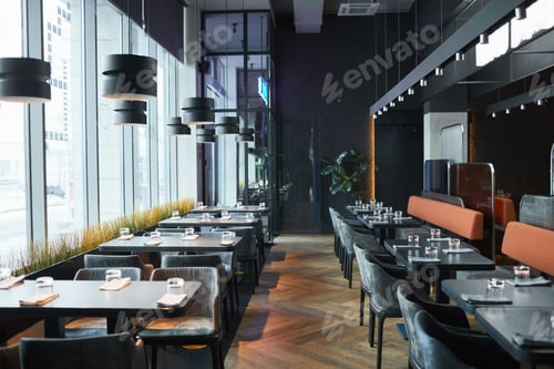 Preview: Rows of restaurant tables and chairs in gray room