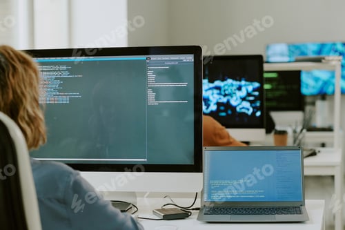 Preview: Young Woman Coding On Computer