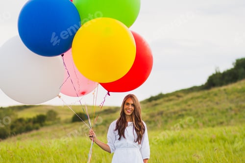 Preview: Woman with a bouquet of giant colorful hopeful balloons birthday celebration special event