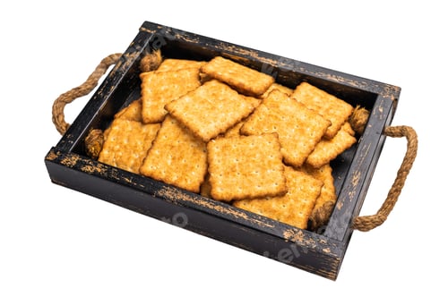 Preview: Square salty crackers in wooden tray isolated on white background, top view