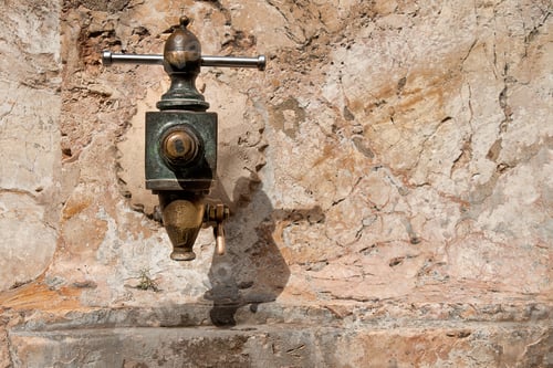 Preview: vintage metal water tap close up in street of Tarragona, Spain