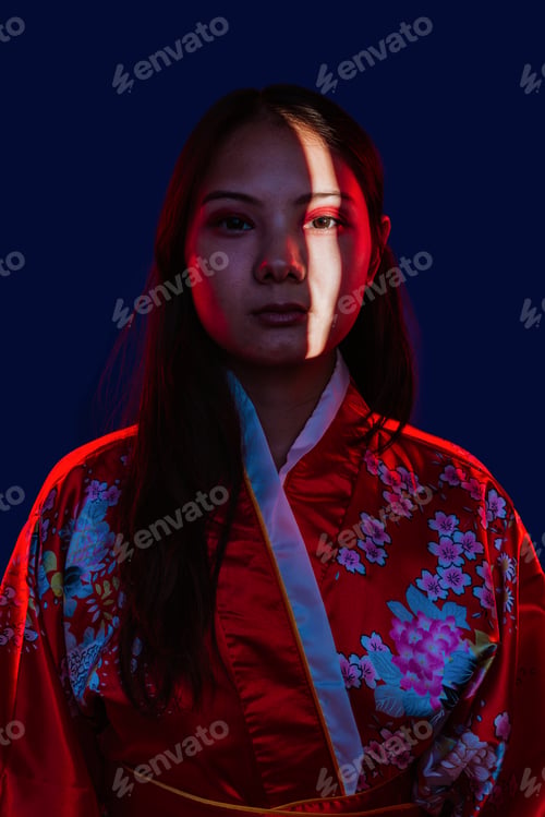 Preview: Asian woman wearing traditional kimono with red light